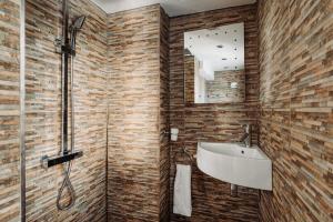 a bathroom with a sink and a shower at Clementine Cottage, Hot Tub, Pool Table, Holcombe Beach 600m in Dawlish +39 photos