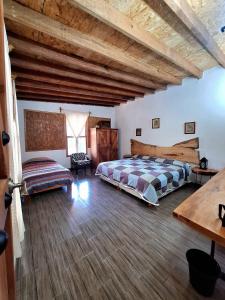Postel nebo postele na pokoji v ubytování Cabaña de los abuelos
