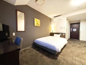Postel nebo postele na pokoji v ubytování Hotel Route-Inn Ageo + 27 fotografií