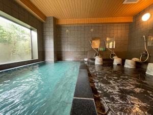 Bazén v ubytování Hotel Route-Inn Ageo nebo v jeho okolí