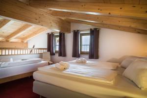 Appartement Kaprun Haus Rudolfにあるベッド