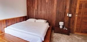 Una cama o camas en una habitación de Mon Chang Home 18 fotos más
