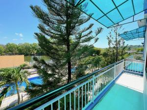 a view from the balcony of a resort with a tree at Villa Sapphire in Vung Tau