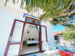 a room with a door leading to a bedroom at Villa Sapphire in Vung Tau