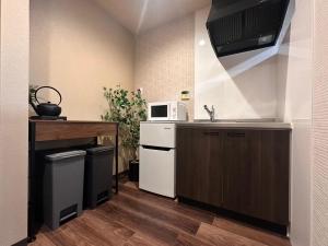 Η κουζίνα ή μικρή κουζίνα στο サイレントハウス東寺京都駅西