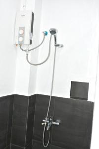 a shower in a bathroom with a shower head at Malapatel in Logon +43 photos