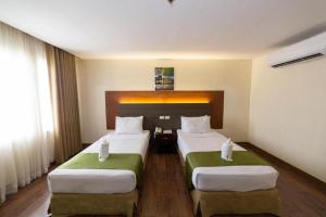 Katil atau katil-katil dalam bilik di The Ritz Hotel at Garden Oases (Multiple-Use Hotel) +33 gambar