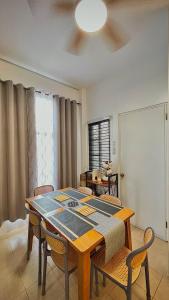 a dining room with a table and chairs at Casa Esperanza 1376 in Dauis