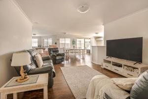 a living room with a large flat screen tv at Spindrift Escape in Dunsborough