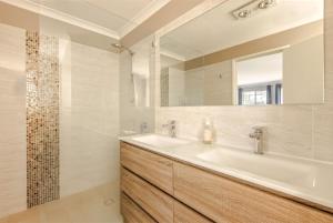 a bathroom with a sink and a mirror at Spindrift Escape in Dunsborough +13 photos