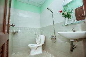 a bathroom with a toilet and a sink at Eden Hotel Sai Gon in Ho Chi Minh City +25 photos
