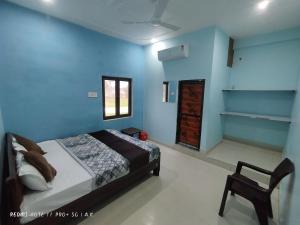 Voodi või voodid majutusasutuse Sri Ram Sundaram Palace toas