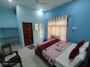 Voodi või voodid majutusasutuse Sri Ram Sundaram Palace toas