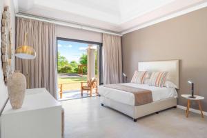 Giường trong phòng chung tại Villa Serenis - Perfect Holidays in Mauritius