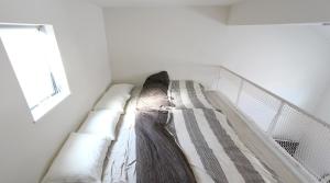 a white bed in a room with a window at Shibuya Stay Tokyo A202 in Tokyo