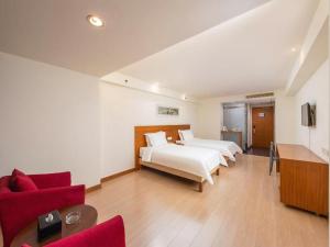 Ένα ή περισσότερα κρεβάτια σε δωμάτιο στο Jinjiang Inn Style Foshan Creative Industrial Park Wangfujing +137 φωτογραφίες