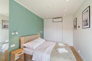 Ένα ή περισσότερα κρεβάτια σε δωμάτιο στο NORTH Apartments, View Mare Solaris