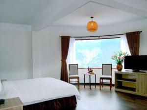 TV a/nebo společenská místnost v ubytování Chapa Dew Boutique Hotel