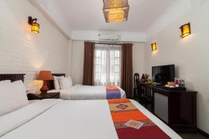 Postel nebo postele na pokoji v ubytování Chapa Dew Boutique Hotel