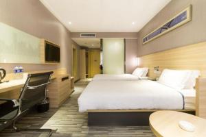 Postel nebo postele na pokoji v ubytování City Comfort Inn Changsha Railway Station
