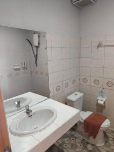 a bathroom with a sink and a toilet at Grand Thai House Resort Lamai in Lamai +22 photos