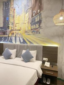 Postel nebo postele na pokoji v ubytování Hotel Pantes Semarang