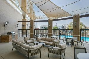 a lobby with couches and tables and a pool at Residence Inn by Marriott Tallahassee Universities at the Capitol in Tallahassee