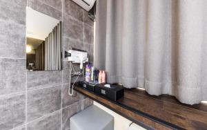 a bathroom with a sink and a mirror and a toilet at Uijeongbu Hotel Bene in Ŭijŏngbu-yŏk +147 photos