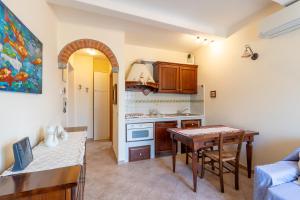 a kitchen with a table and a dining room at Casa Vacanze Caterina in Corniglia