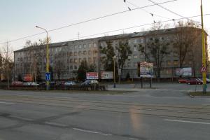 an empty street in front of a large building at ŠD Urbánkova 2 in Košice