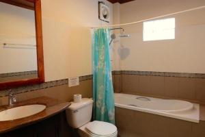 a bathroom with a sink and a toilet and a bath tub at Villa Malida in Luang Prabang +107 photos