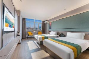 Postel nebo postele na pokoji v ubytování City Comfort Inn Shantou Jinhu Road Branch + 245 fotografií