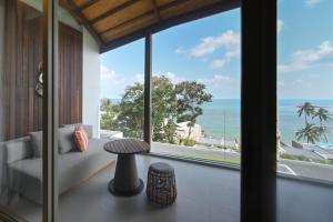 a room with a view of the ocean at Rocky's Boutique Resort - Veranda Collection Samui in Lamai
