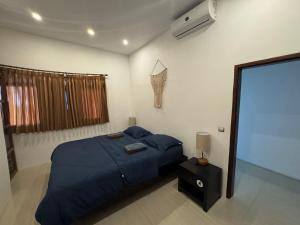 Postel nebo postele na pokoji v ubytování Surf Bali Villa
