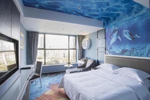 a bedroom with a large bed with a blue ceiling at Guangzhou Rongjin hotel in Guangzhou +253 photos