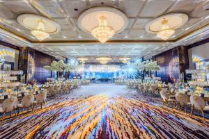 a rendering of a banquet hall with tables and chairs at Beach Rotana - Abu Dhabi in Abu Dhabi
