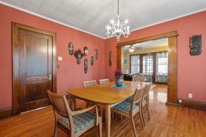 a dining room with a wooden table and chairs at Uptown Urban Living in Minneapolis