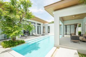 an image of a swimming pool in a house at Mouana Breeze Mai Khao 4-bedroom Pool Villa 9922 in Mai Khao Beach