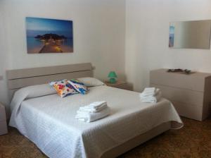 Кровать или кровати в номере Appartamento Uso turistico Da Cristina