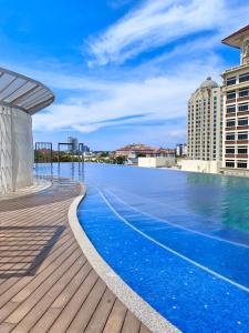 a swimming pool on the roof of a building at Netflix Two Bedroom Troika Kota Bharu Homestay 118 in Kota Bharu