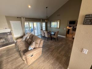 a living room with a couch and a table at Riverside Views & Pool Retreat in Riverside