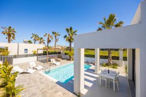an aerial view of a villa with a swimming pool at Villa Salty Sun 2 in Kremasti