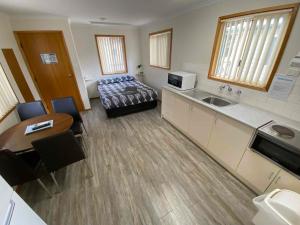 Postel nebo postele na pokoji v ubytování Ardrossan Caravan Park
