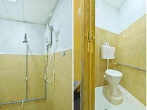 a bathroom with a shower and a toilet at OYO 90535 Wakaf Bharu Inn in Kota Bharu +90 photos