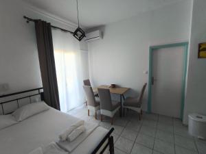 Postel nebo postele na pokoji v ubytování Galini Apartments