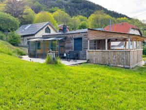 a log house with a patio and a yard at La Guinguette de Lus in Lus-la-Croix-Haute +11 photos