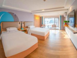 Postel nebo postele na pokoji v ubytování City Comfort Inn Hengyang Nanyue Scenic Spot Temple