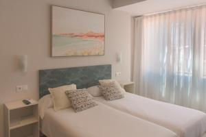 Postel nebo postele na pokoji v ubytování Dormavalencia Hostel Regne