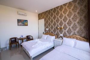 Postel nebo postele na pokoji v ubytování Royal Hotel + 52 fotografií