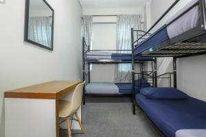 Postel nebo postele na pokoji v ubytování SPOT ON 89751 Bed Station Guest House